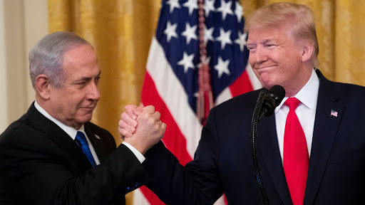 Mandatory Credit: Photo by MICHAEL REYNOLDS/EPA-EFE/Shutterstock (10541711a)US President Donald J. Trump (R) shakes hands with Prime Minister of Israel Benjamin Netanyahu while unveiling his Middle East peace plan in the East Room of the White House, in Washington, DC, USA, 28 January 2020. US President Donald J. Trump's Middle East peace plan is expected to be rejected by Palestinian leaders, having withdrawn from engagement with the White House after Trump recognized Jerusalem as the capital of Israel. The proposal was announced while Netanyahu and his political rival, Benny Gantz, both visit Washington, DC.US President Donald J. Trump unveils his Middle East peace plan alongside Prime Minister of Israel Benjamin Netanyahu, Washington, USA - 28 Jan 2020